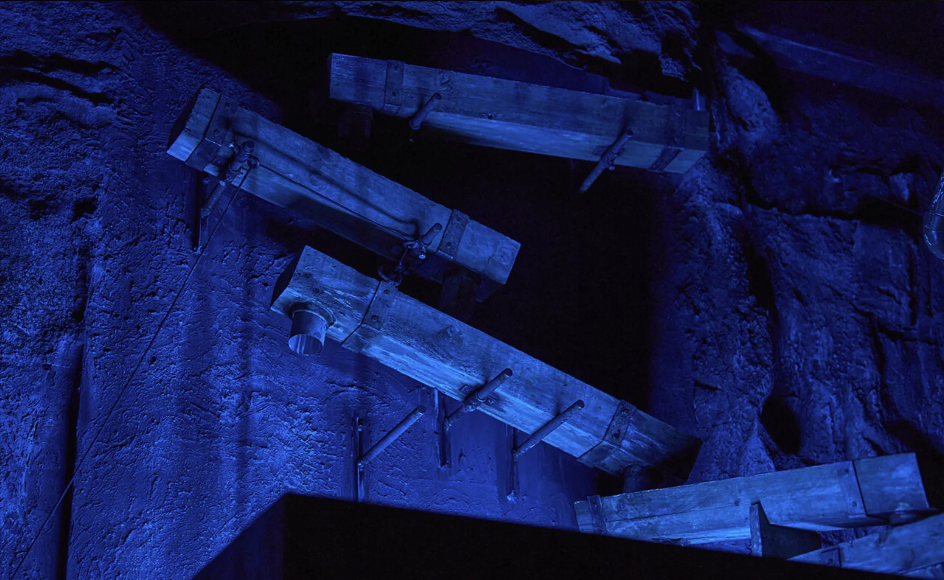 Blue-lit mine timbers